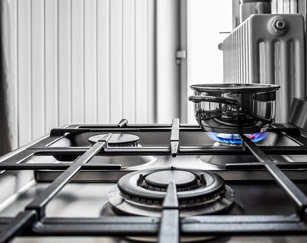Small metal pan on the stove in the kitchen